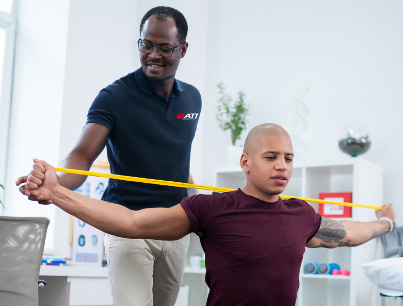 Male cancer patient receives oncology physical therapy for cancer rehabilitation